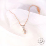 Modern minimal diamond drop pendant necklace with graduated stones