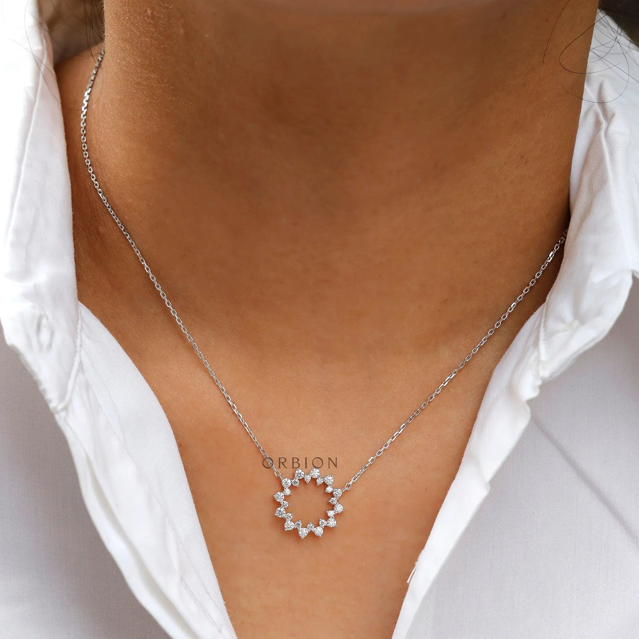 Everyday diamond circle necklace worn on neckline