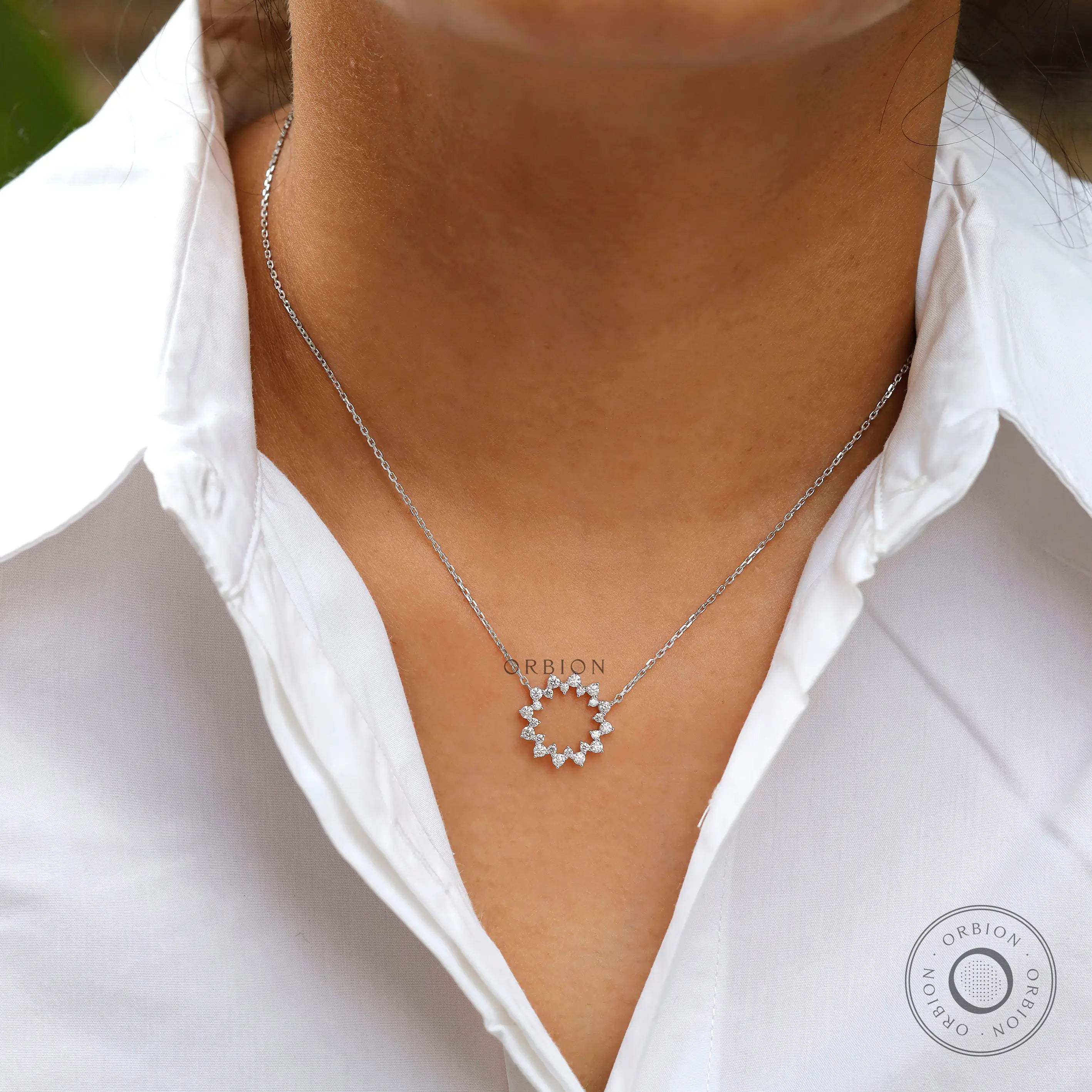 Everyday diamond circle necklace worn on neckline