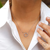 White gold diamond circle necklace on neckline