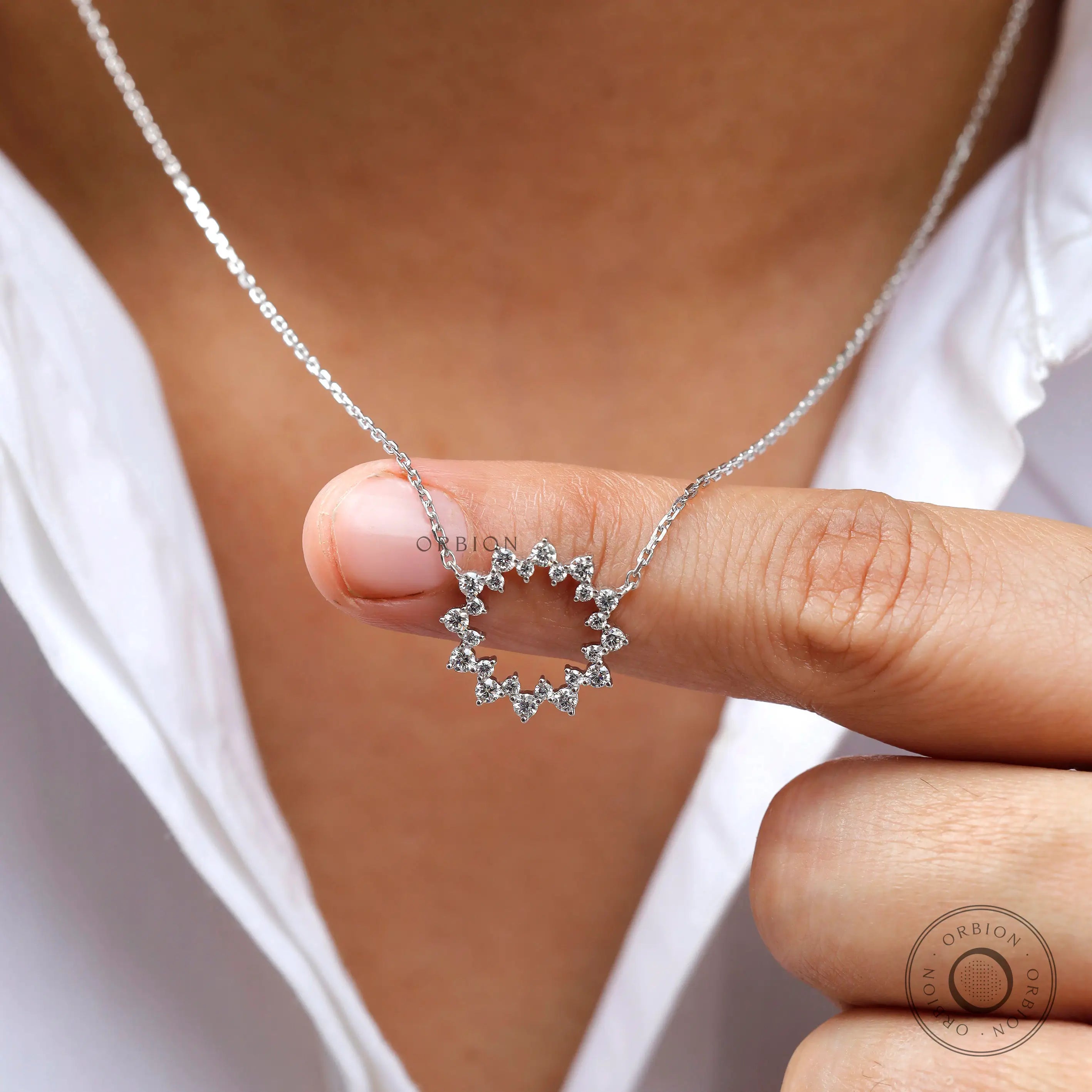 Minimalist diamond circle pendant necklace close-up view