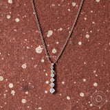 14k rose gold necklace with graduated lab-grown diamonds in a long drop design, perfect for daily wear.