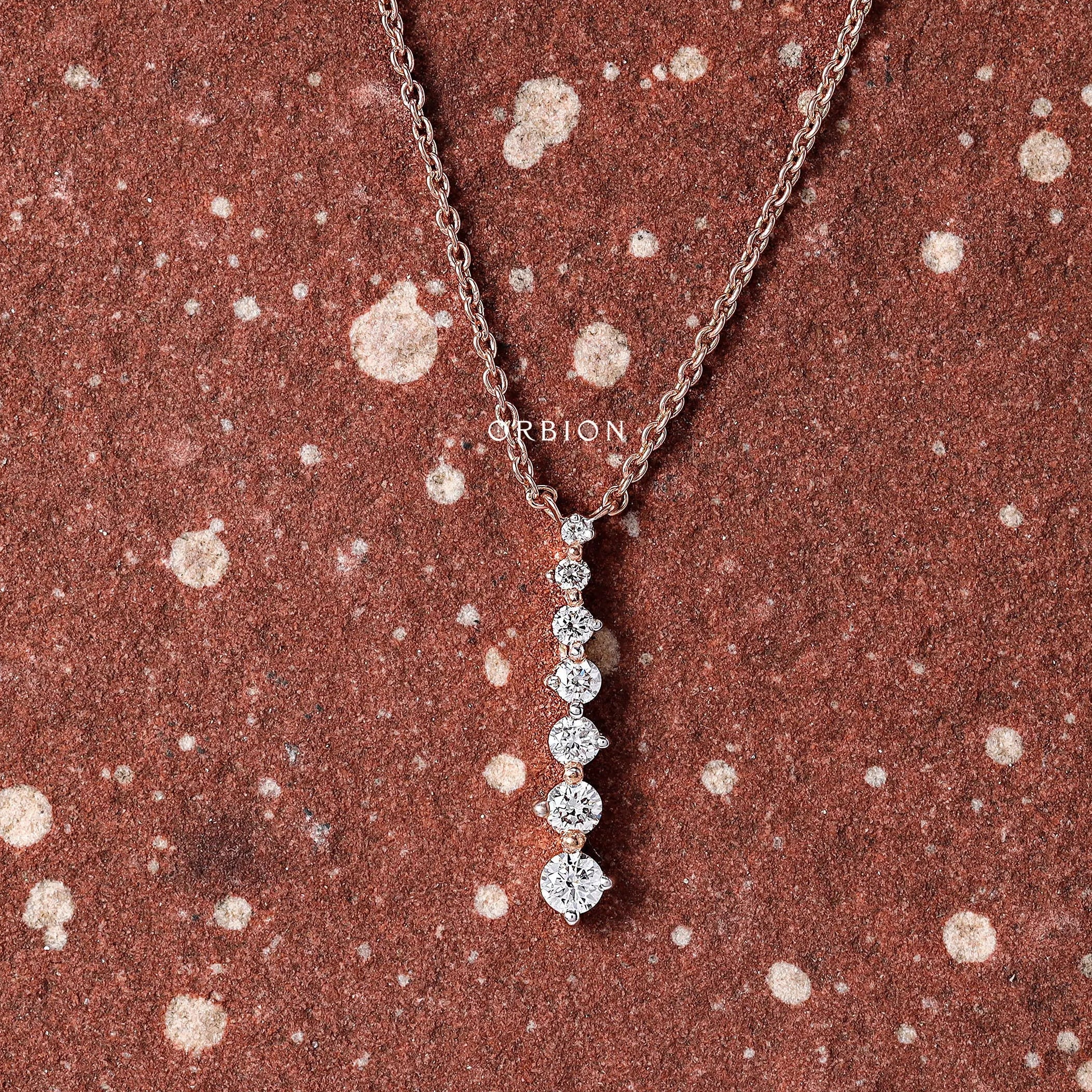 14k rose gold necklace with graduated lab-grown diamonds in a long drop design, perfect for daily wear.