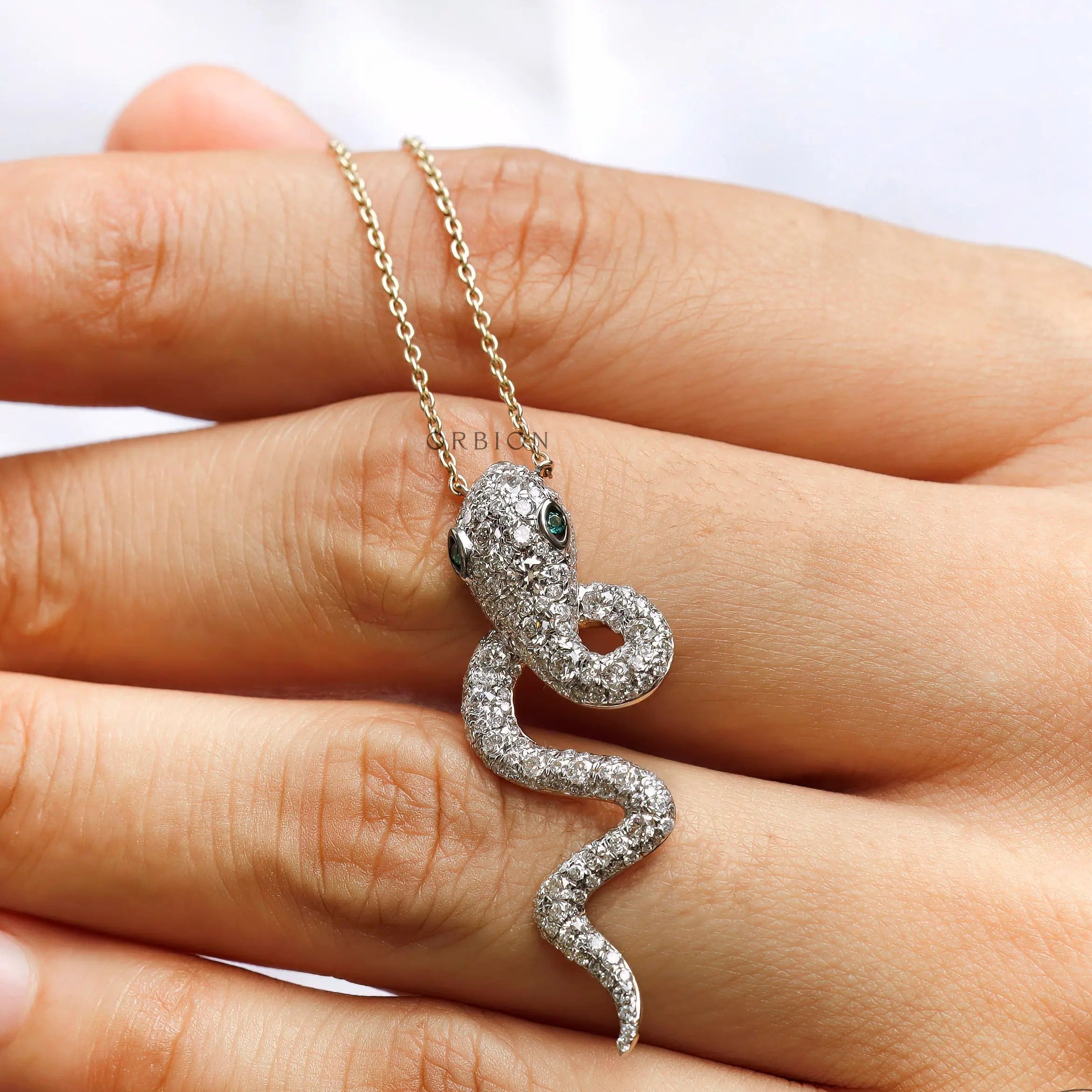 High polish 18K gold iced out serpent pendant