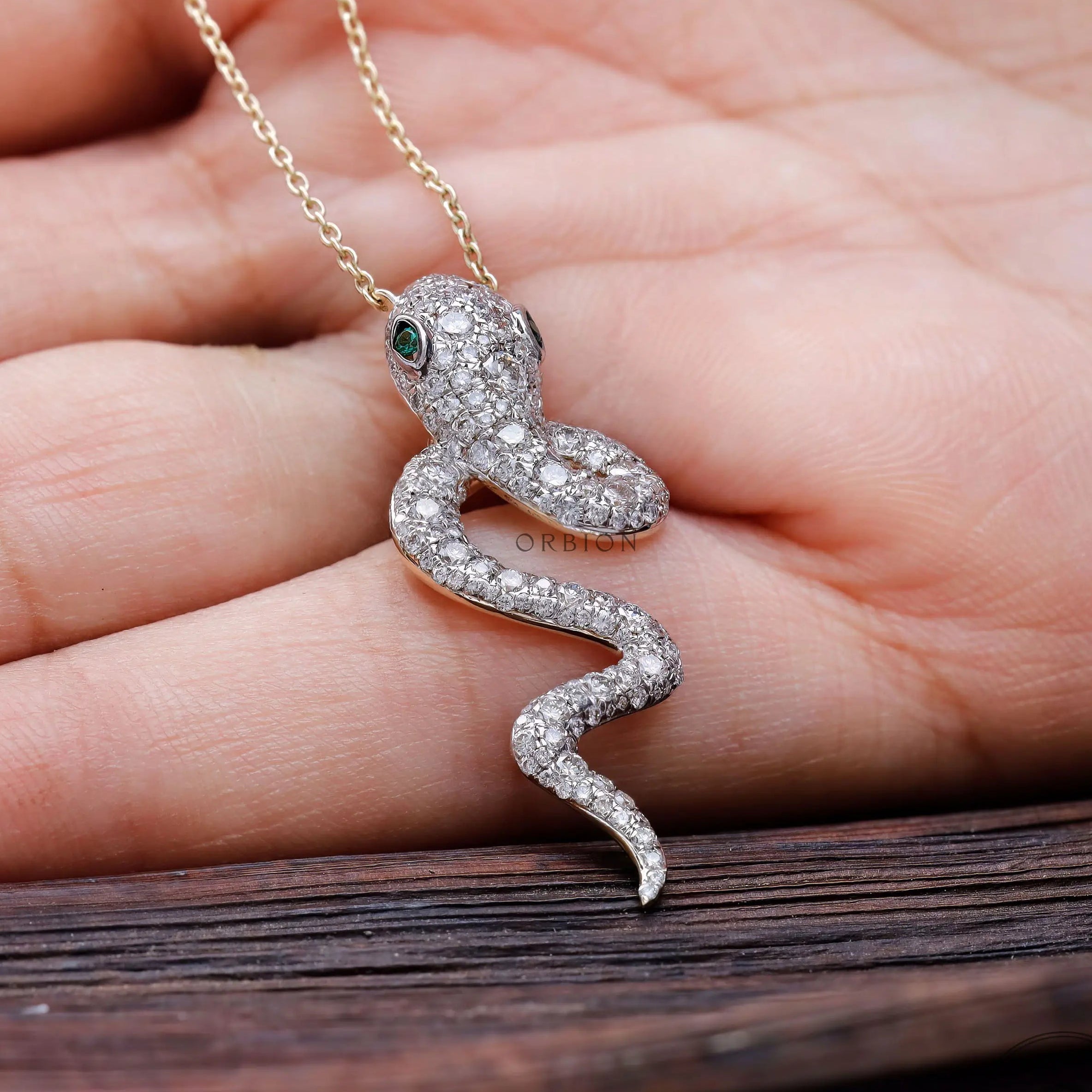 Detailed pave lab diamond snake head pendant close up