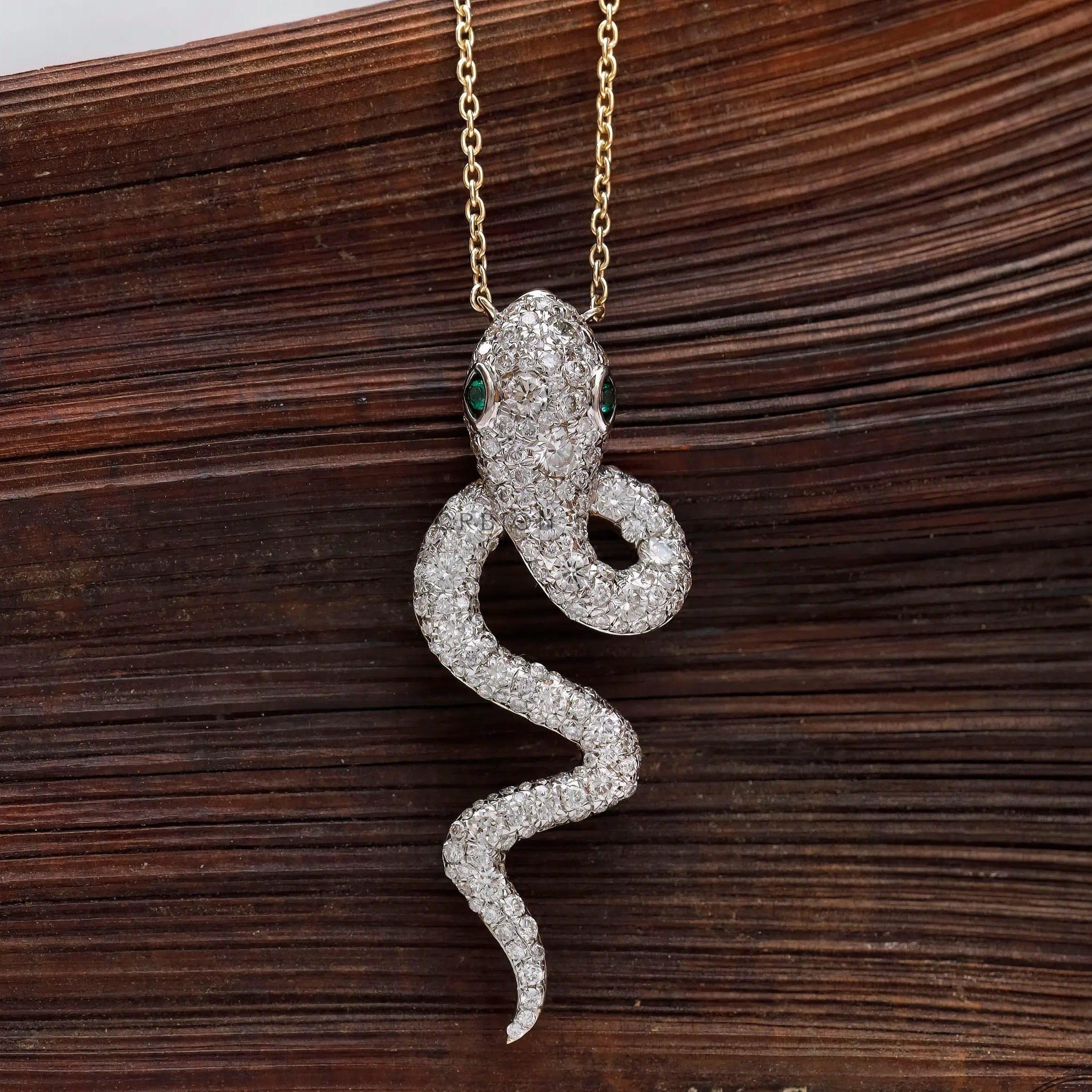 Solid gold pave diamond snake necklace charm macro detail