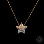 Flush set diamond star necklace in 14K yellow gold close up