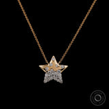 Flush set diamond star necklace in 14K yellow gold close up