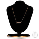 Scattered diamond bar necklace displayed on a jewelry stand