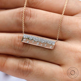 Close-up view of scattered lab diamond pendant necklace