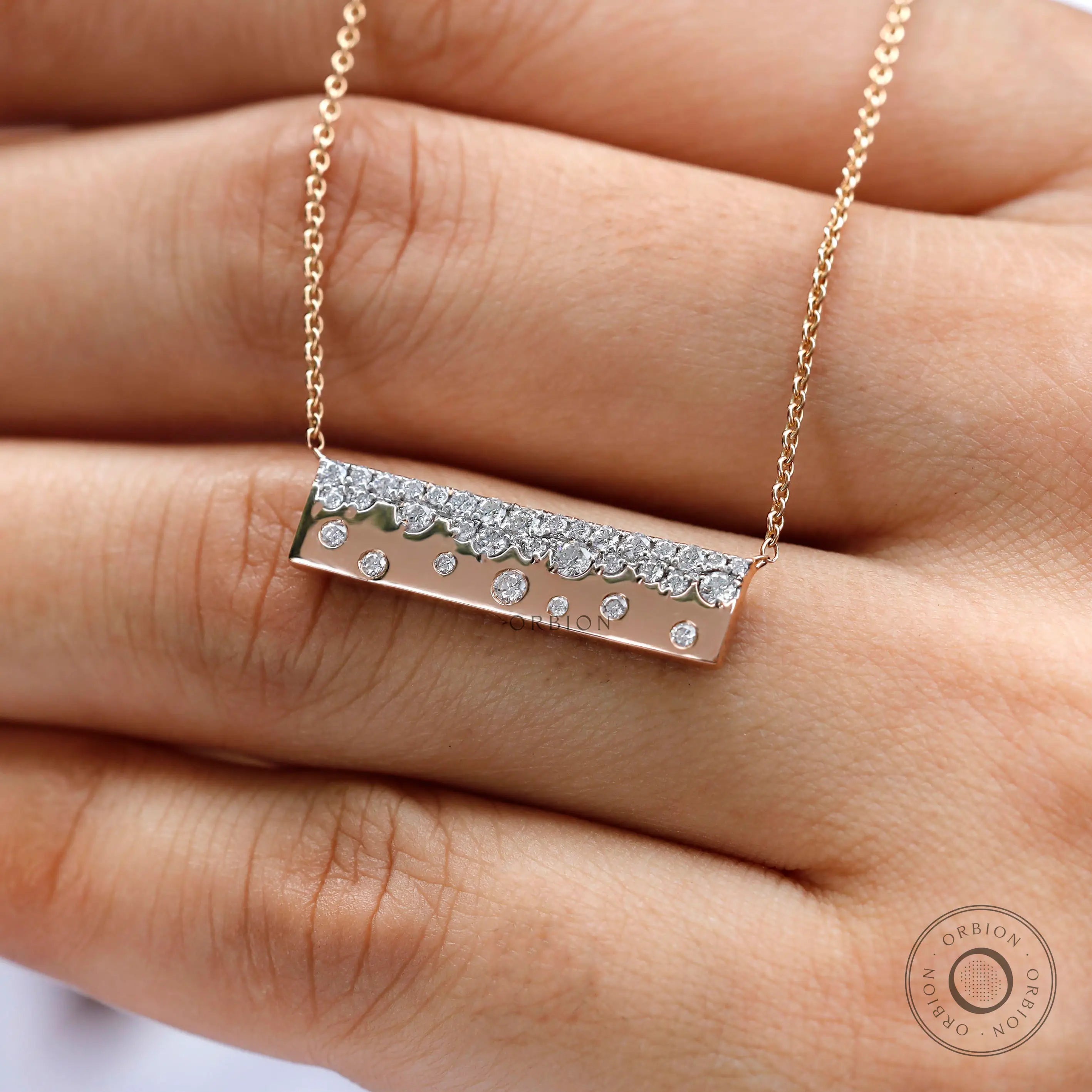 Close-up view of scattered lab diamond pendant necklace
