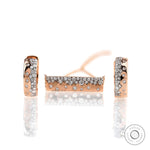 Close up of confetti bar pendant with matching earrings, diamonds set in rose gold