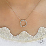 Sustainable lab diamond circle pendant on a model