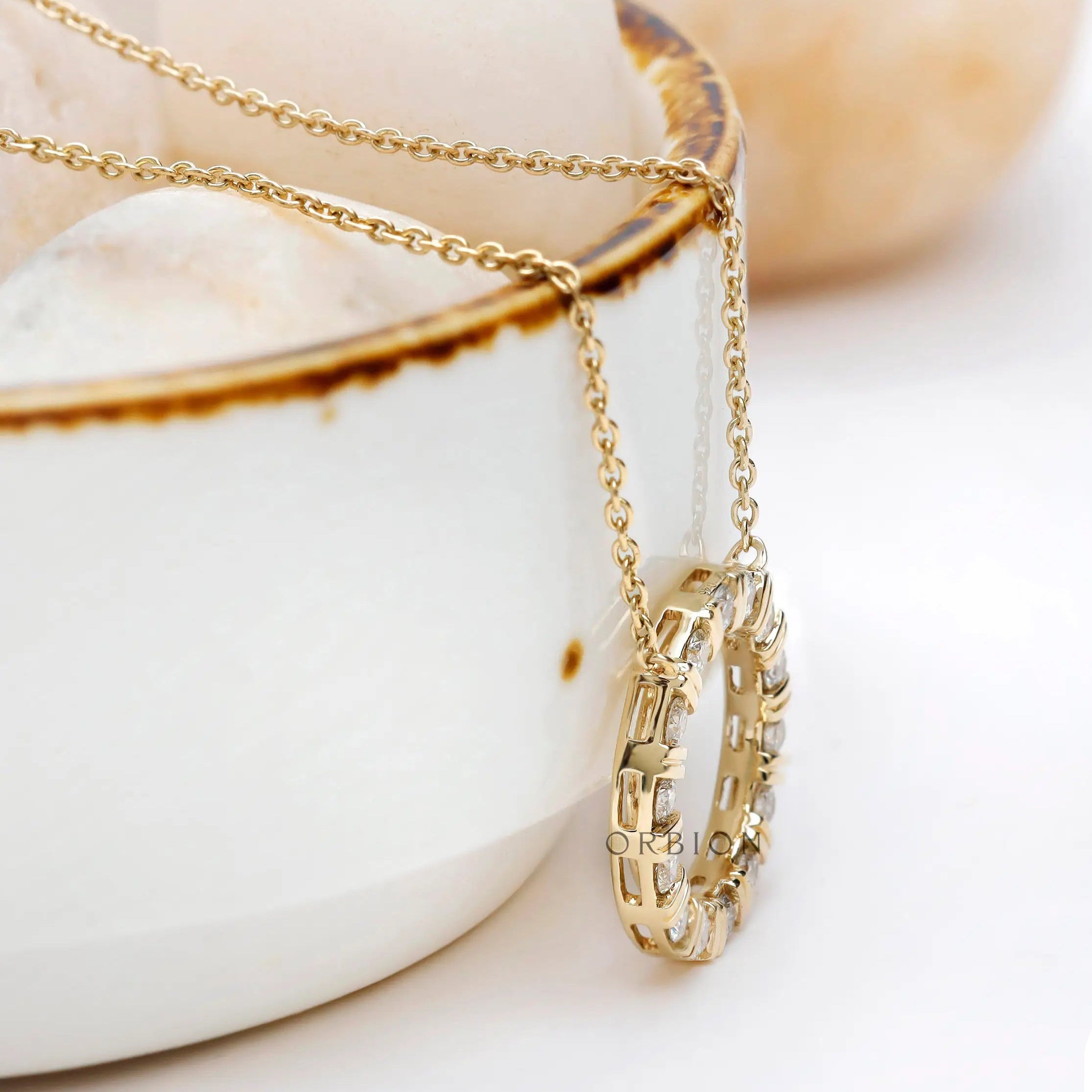 Close-up view of 14k yellow gold lab diamond circle necklace