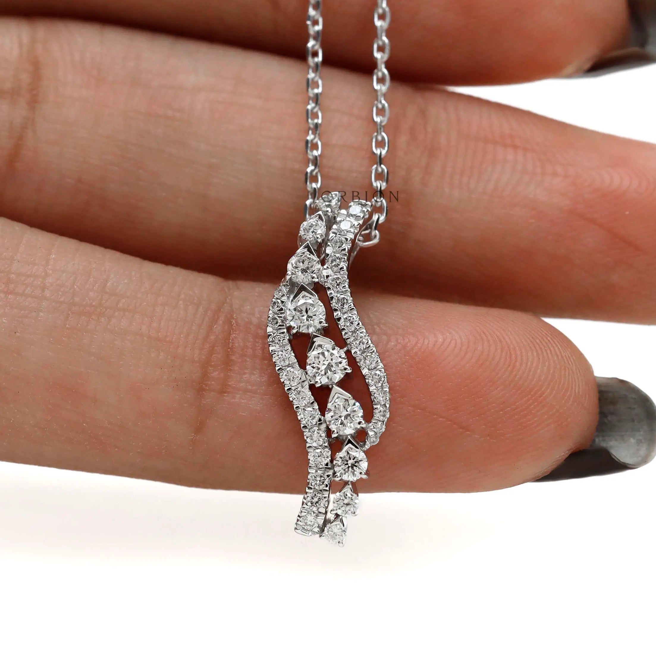 Fine diamond pendant necklace with flowing swirl pattern