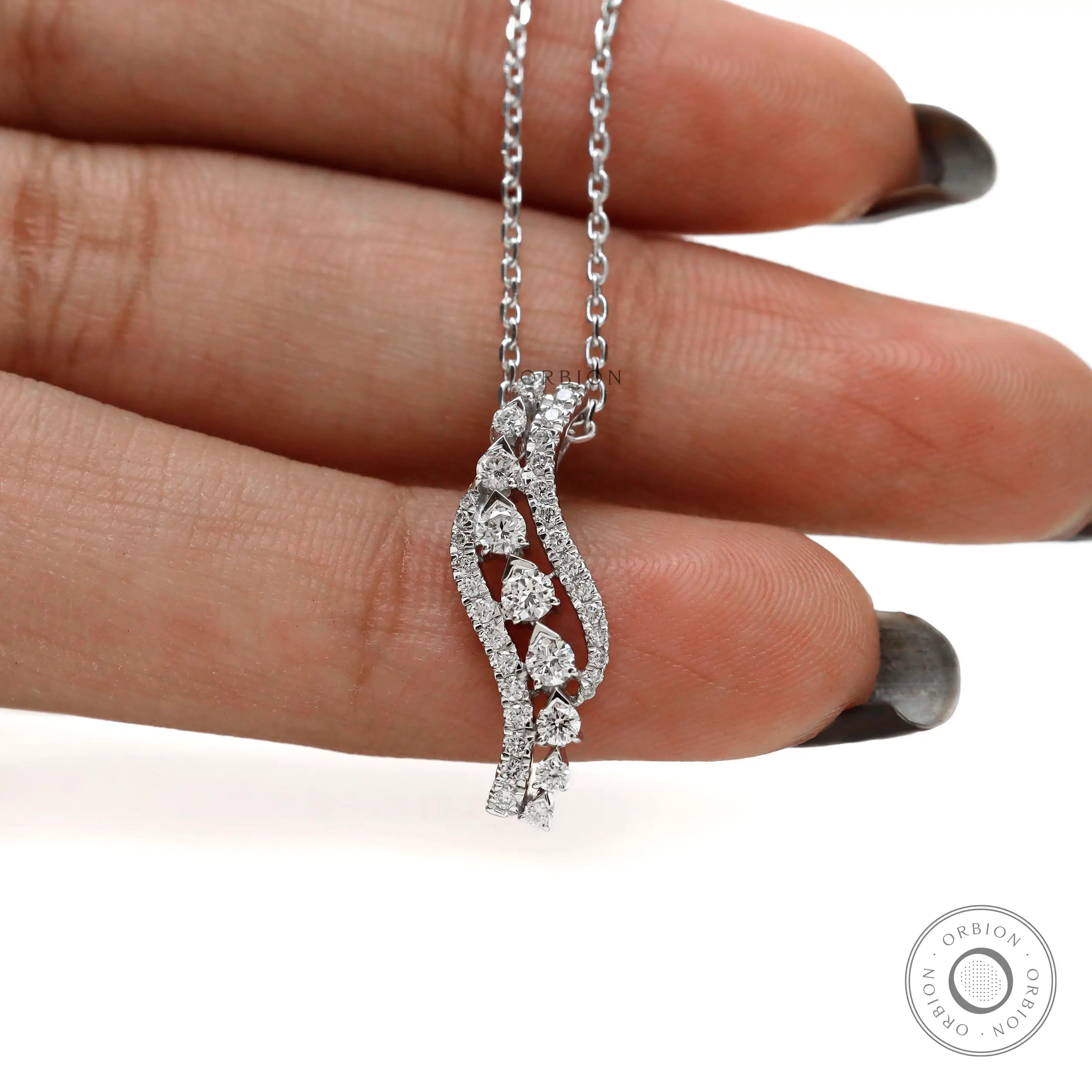 Fine diamond pendant necklace with flowing swirl pattern
