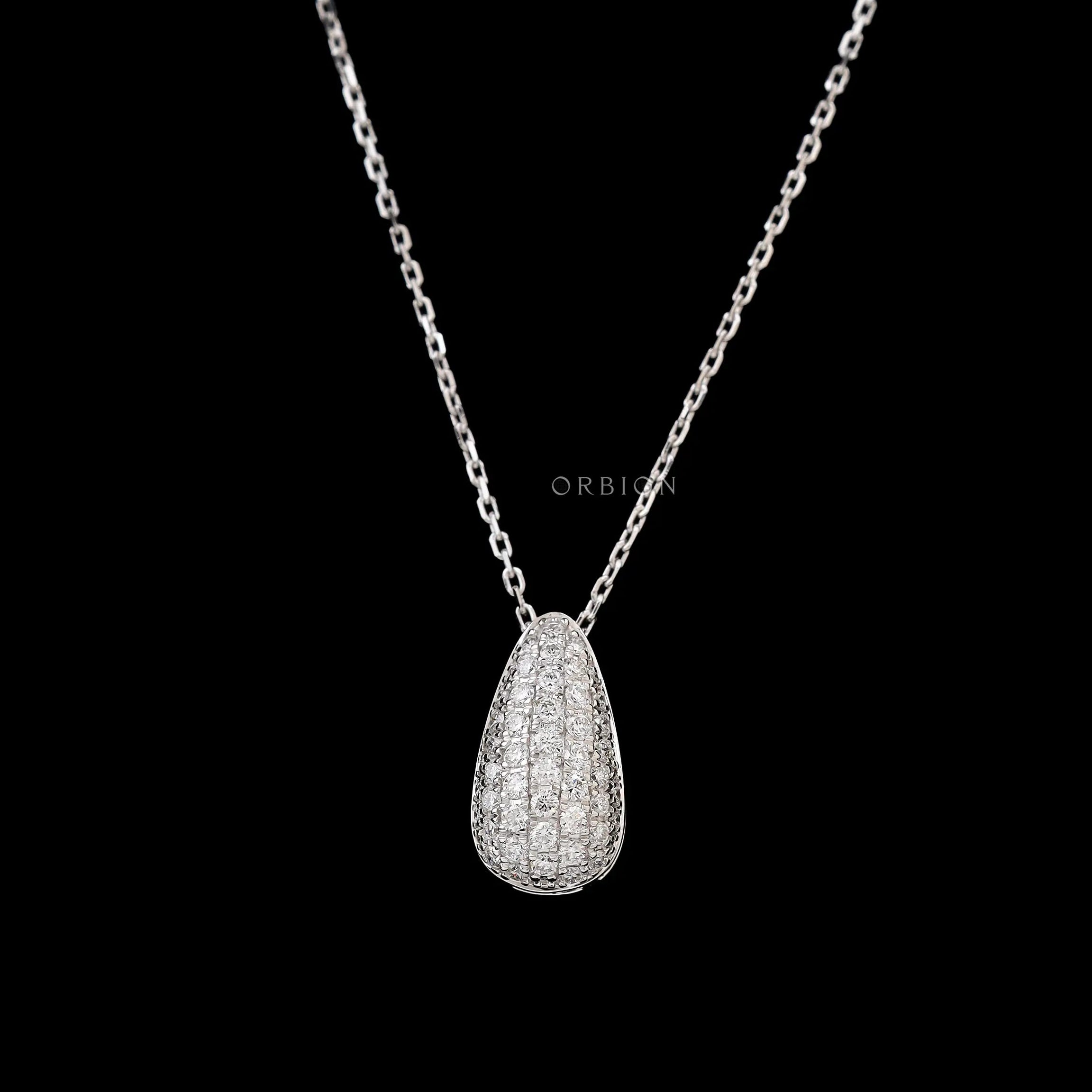 Close up of teardrop diamond pendant with pave setting