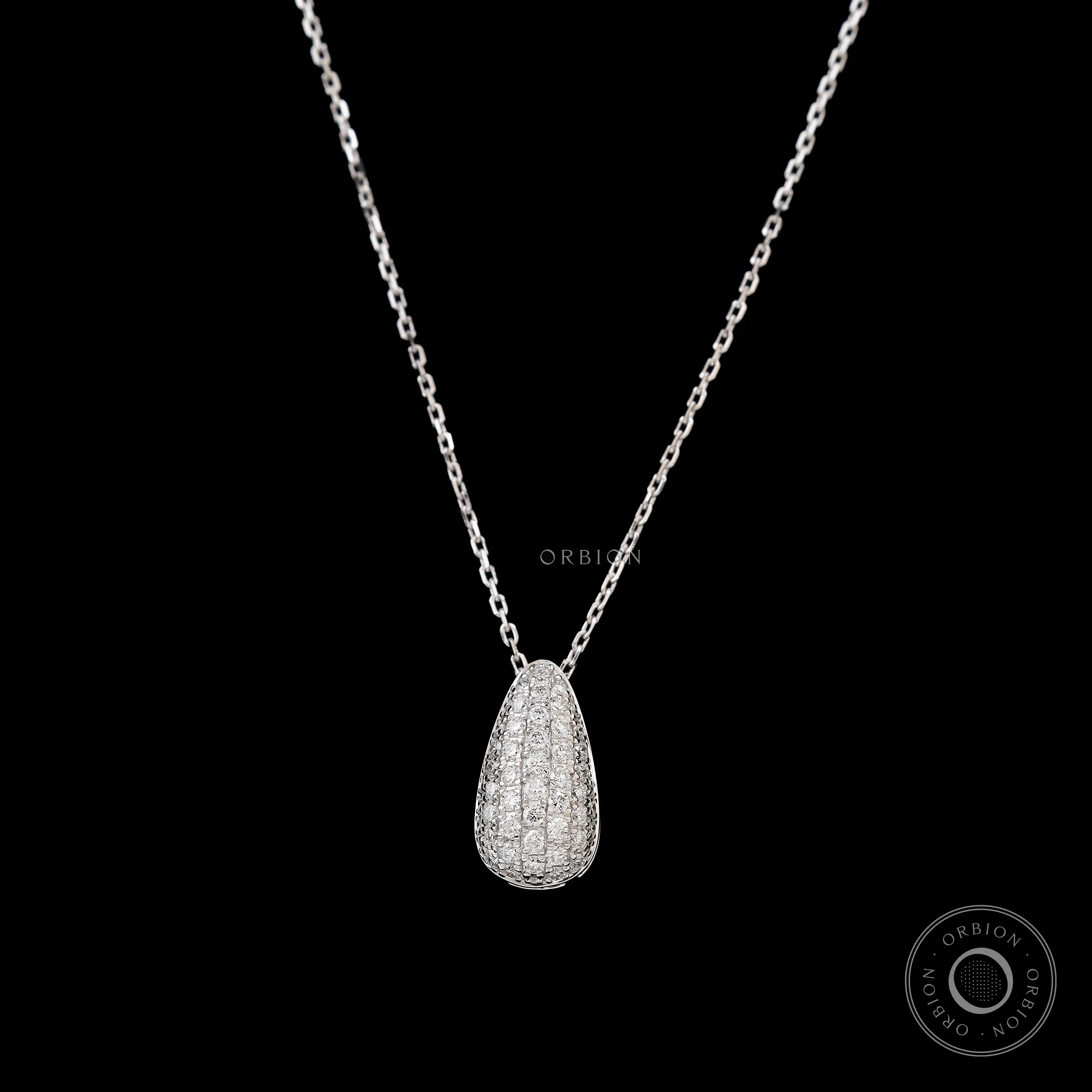 Close up of teardrop diamond pendant with pave setting