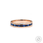 Princess cut blue sapphire channel set half eternity band in 14k rose gold