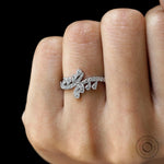 White gold wave engagement ring with pave band close up
