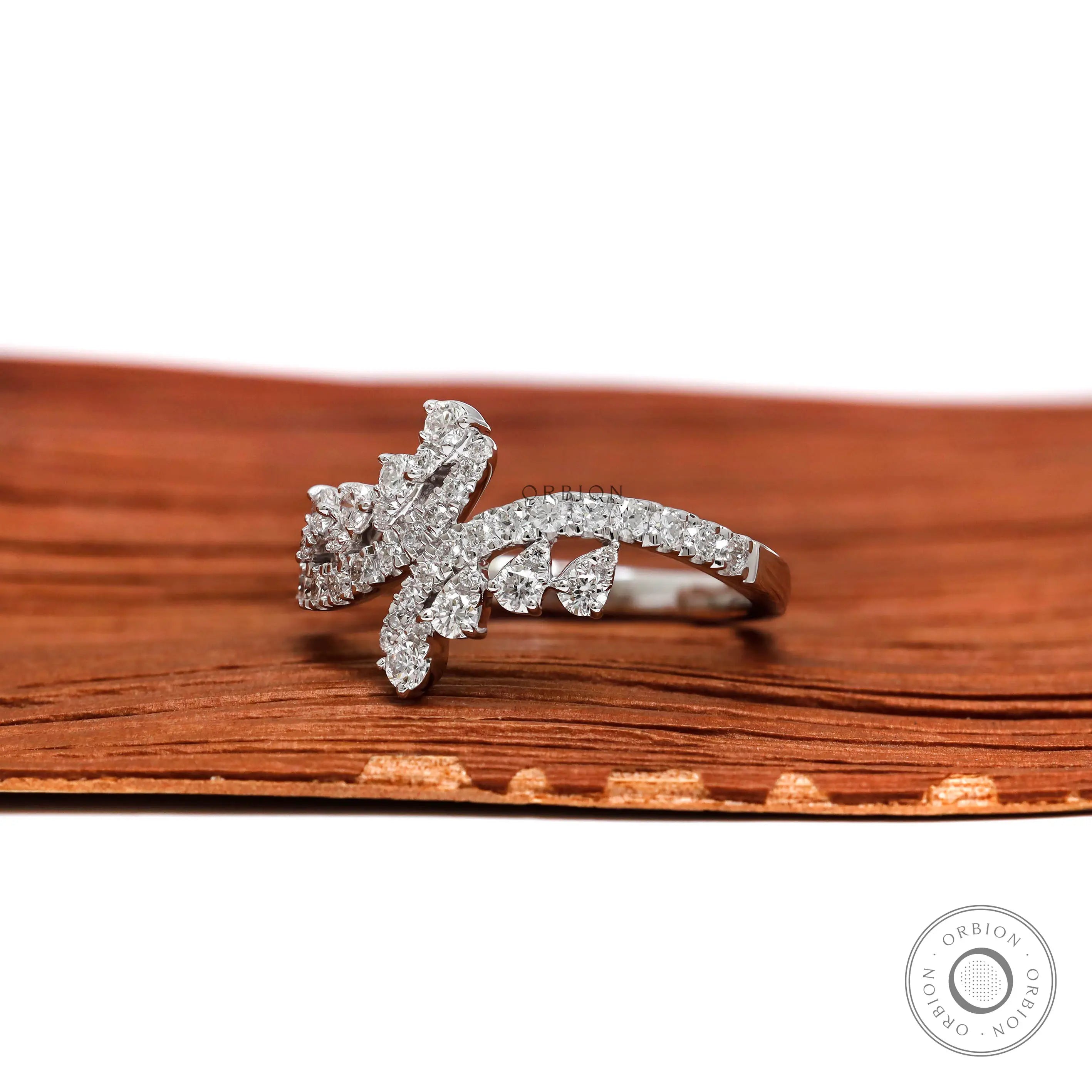 Side profile of wave cluster engagement ring in white gold