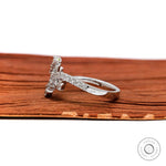 White gold wave engagement ring with pave band