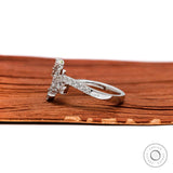 White gold wave engagement ring with pave band