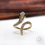 Diamond and emerald snake ring in 14k yellow gold front view