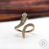 Diamond and emerald snake ring in 14k yellow gold front view