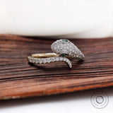 Snake ring with pave lab diamonds and emerald eyes in 10k yellow gold front view
