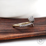 Designer snake ring with lab diamonds on wooden surface