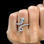 Statement snake ring with pave diamonds and emerald accents