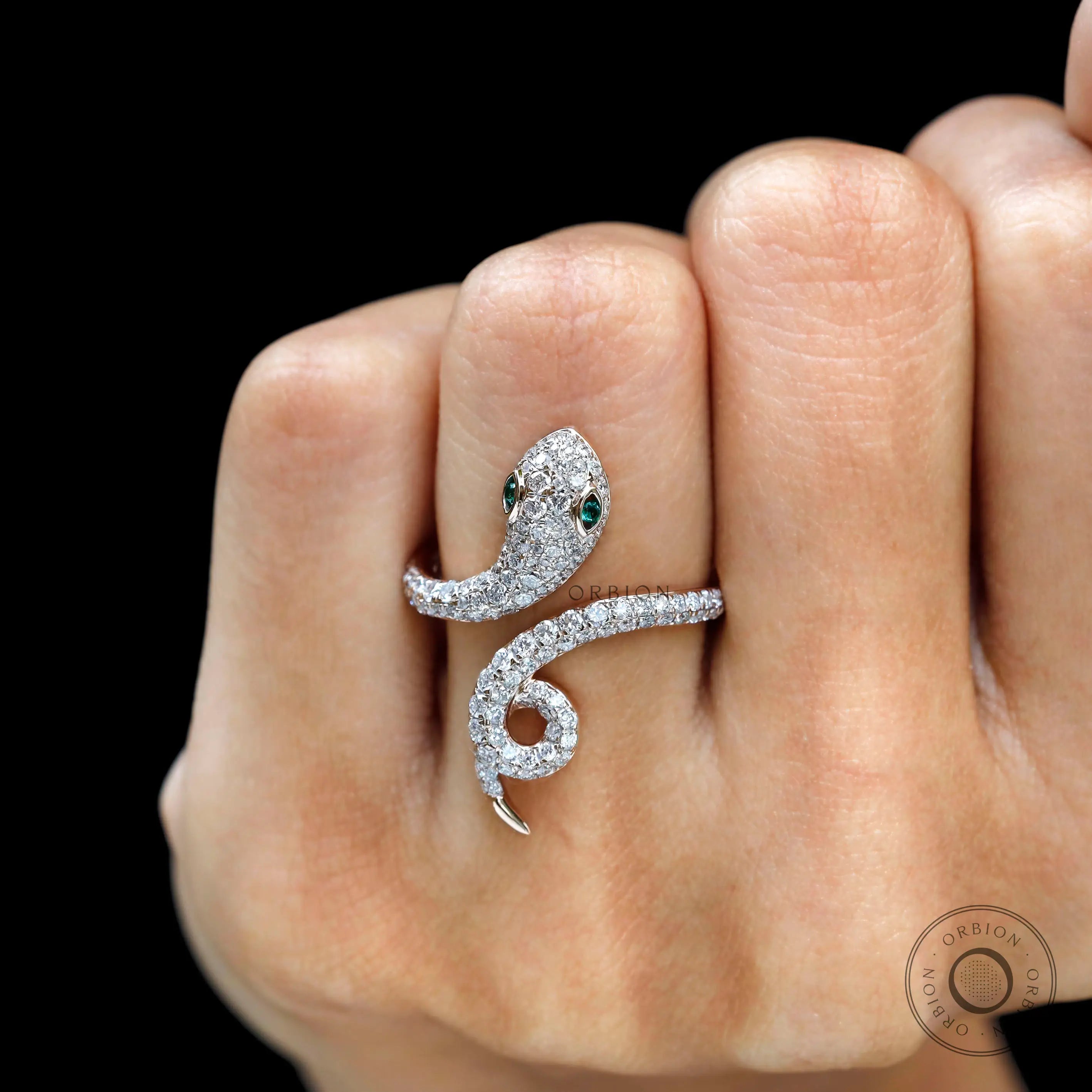 Statement snake ring with pave diamonds and emerald accents