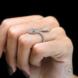 Diamond snake ring worn on hand showing sculpted snake head