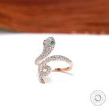 Side profile of rose gold snake ring with emerald eye detail
