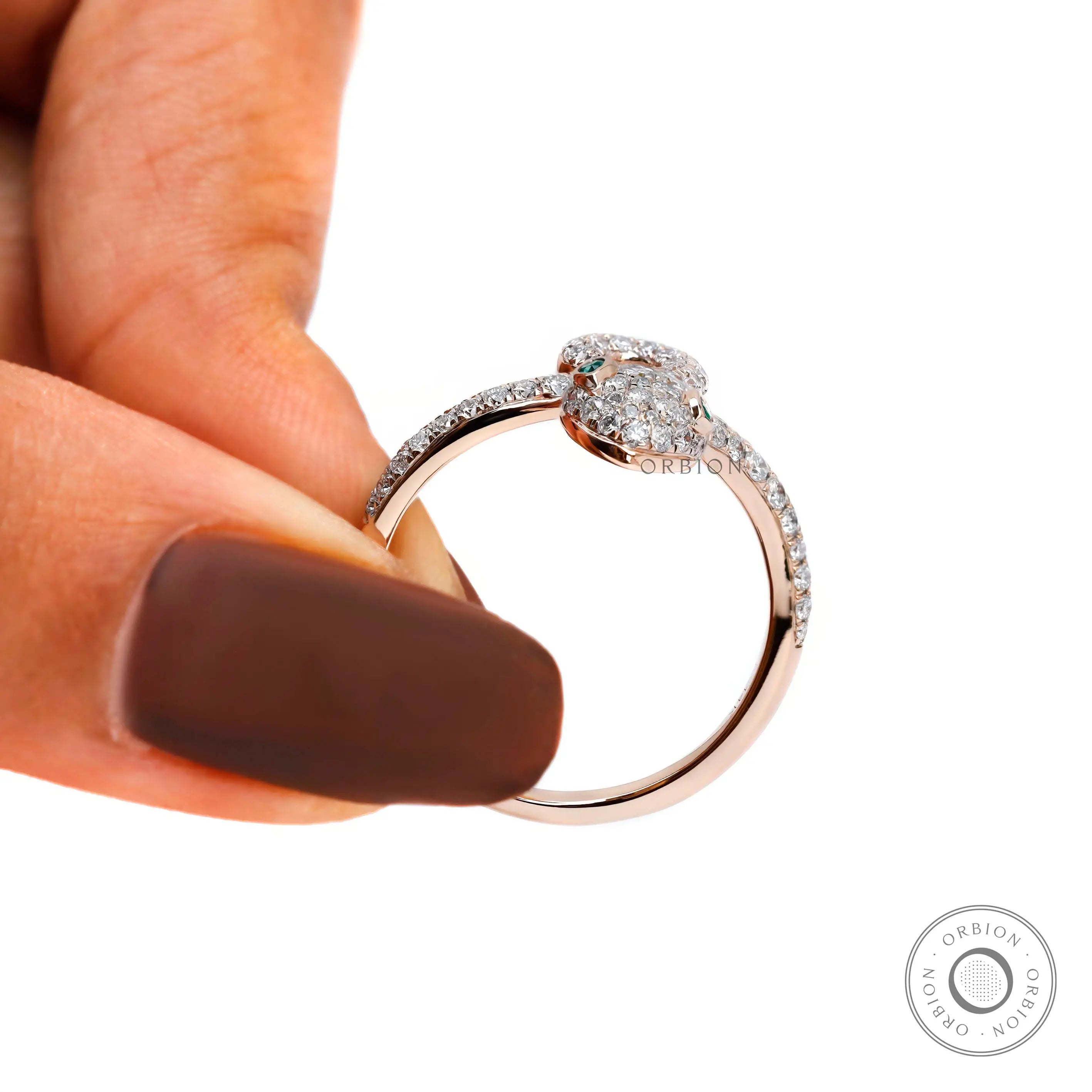 Rose gold serpent ring symbolic jewelry design