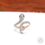 Pave diamond snake ring with emerald eyes in 14k rose gold