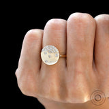 Confetti diamond galaxy ring on hand in yellow gold