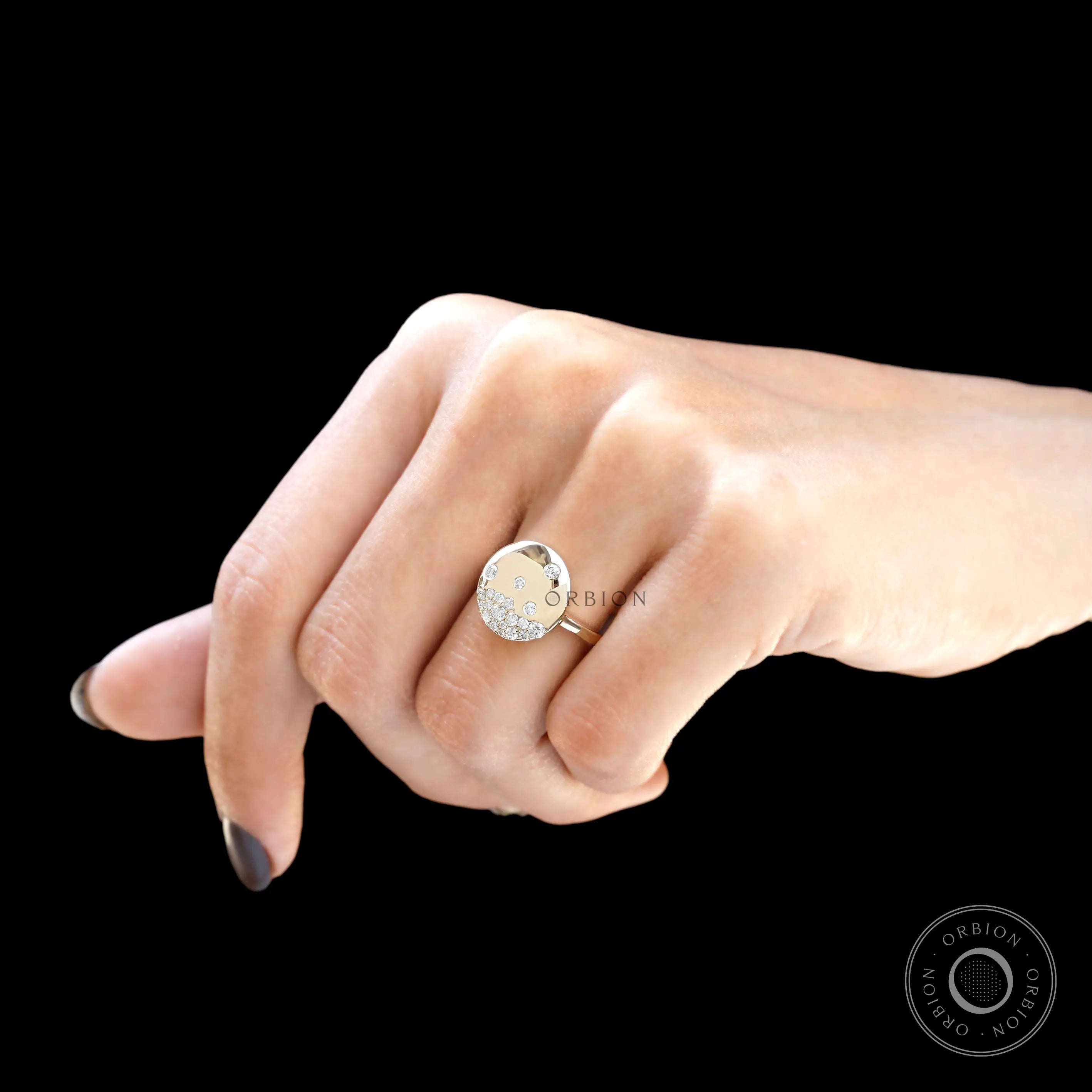 Round brilliant flush set diamond gold ring on finger