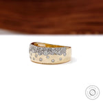 Angled view of gold confetti cigar band with scattered diamond pattern
