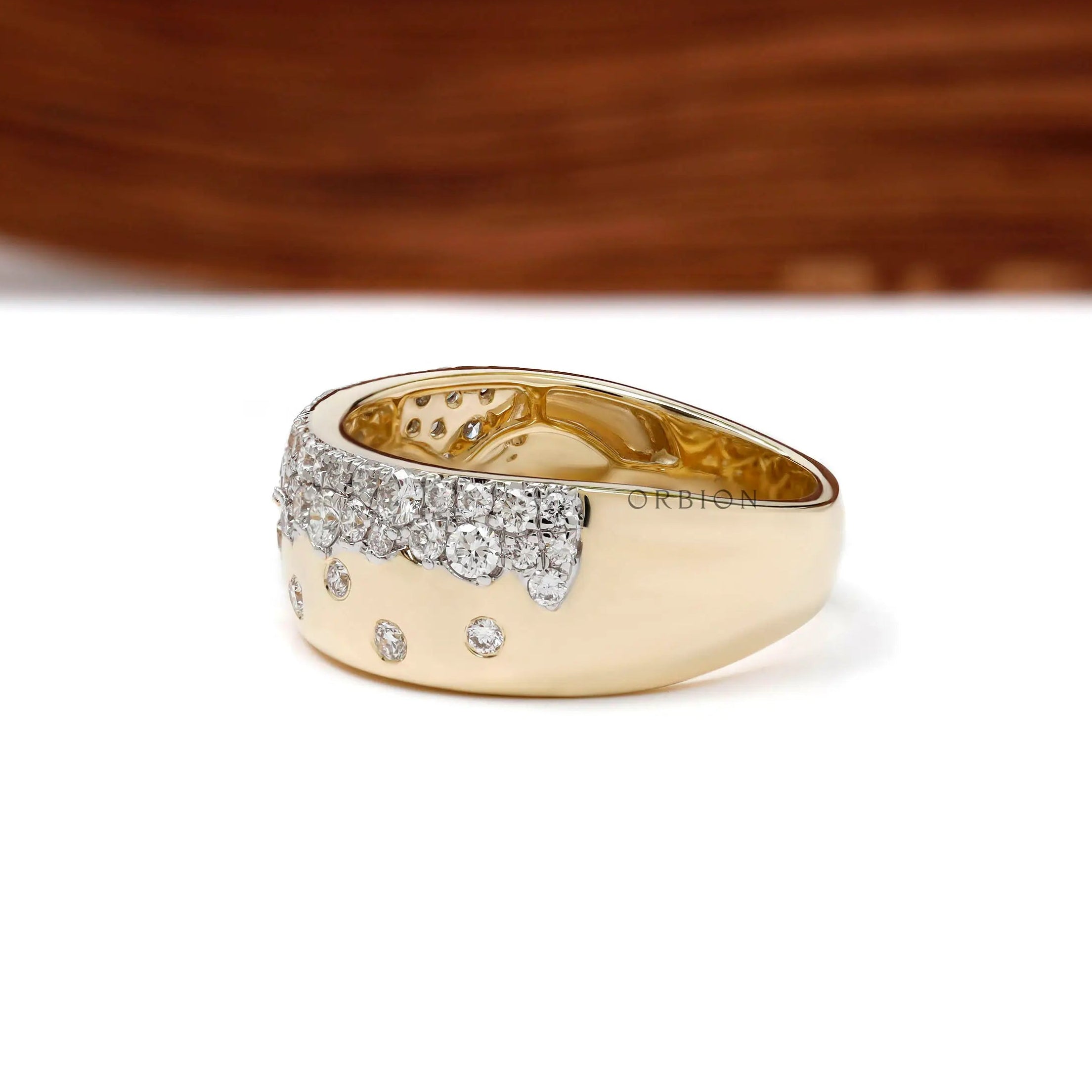 Side perspective of diamond snowfall cigar band showing wide gold profile