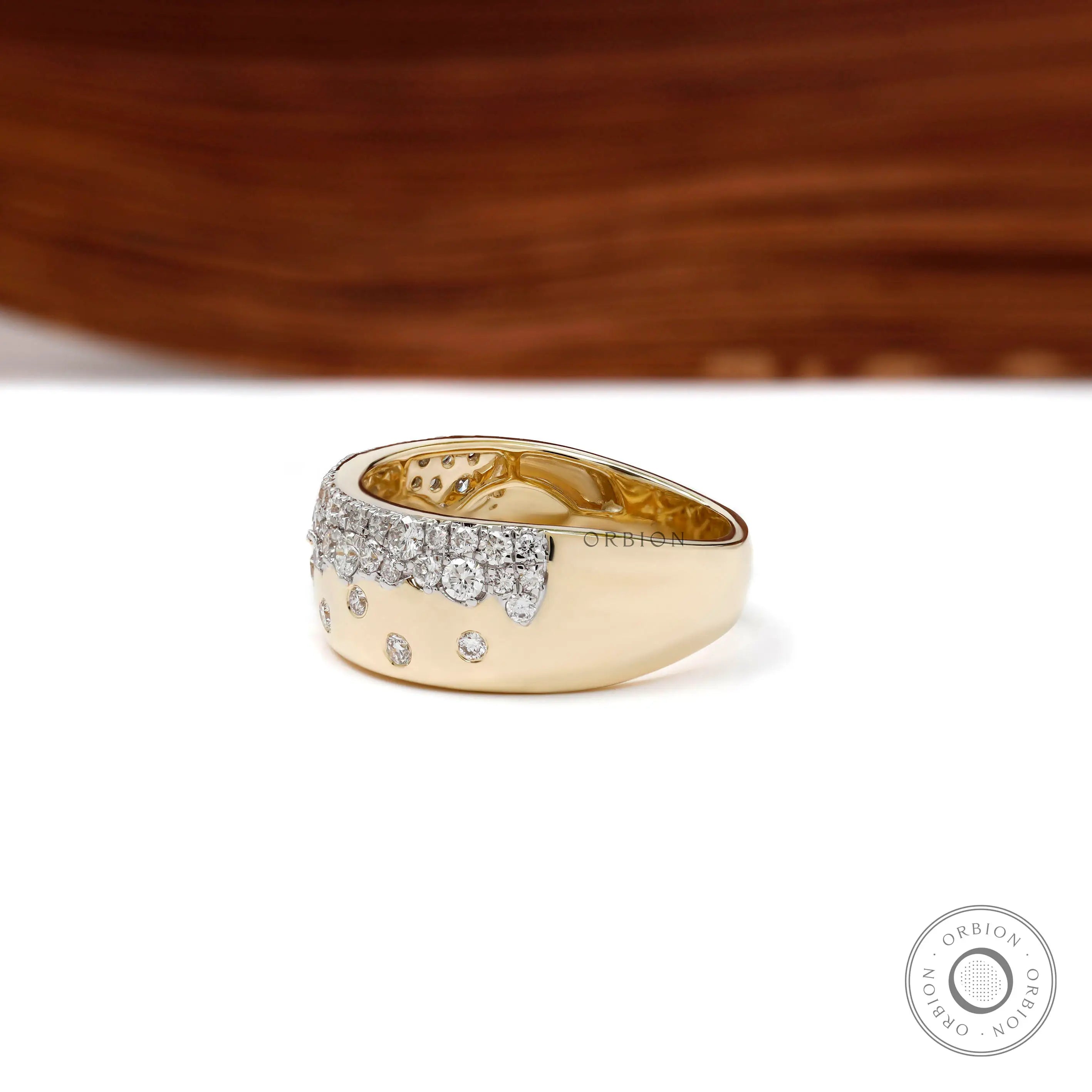 Side perspective of diamond snowfall cigar band showing wide gold profile