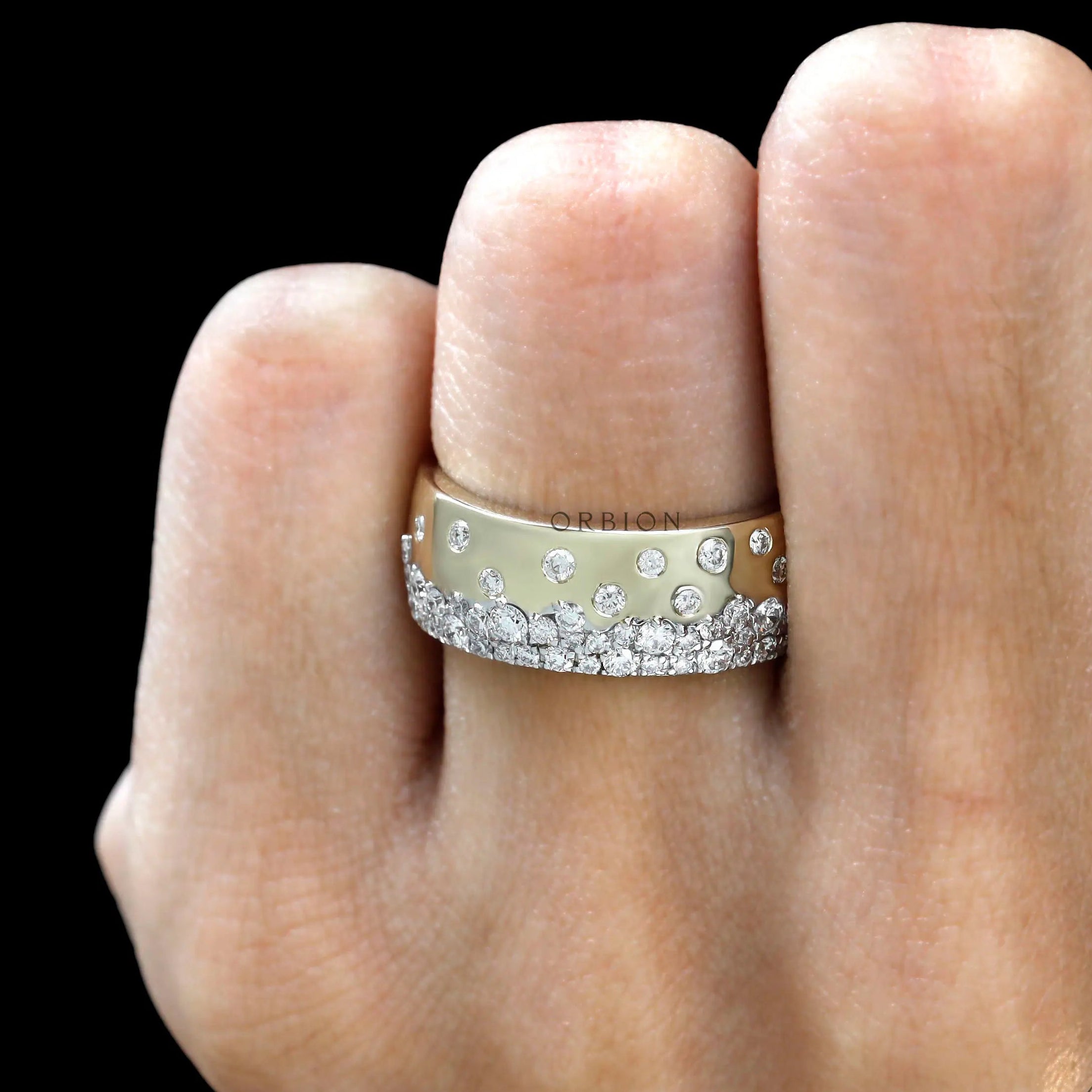 Diamond snowfall cigar band worn on finger for scale and fit reference