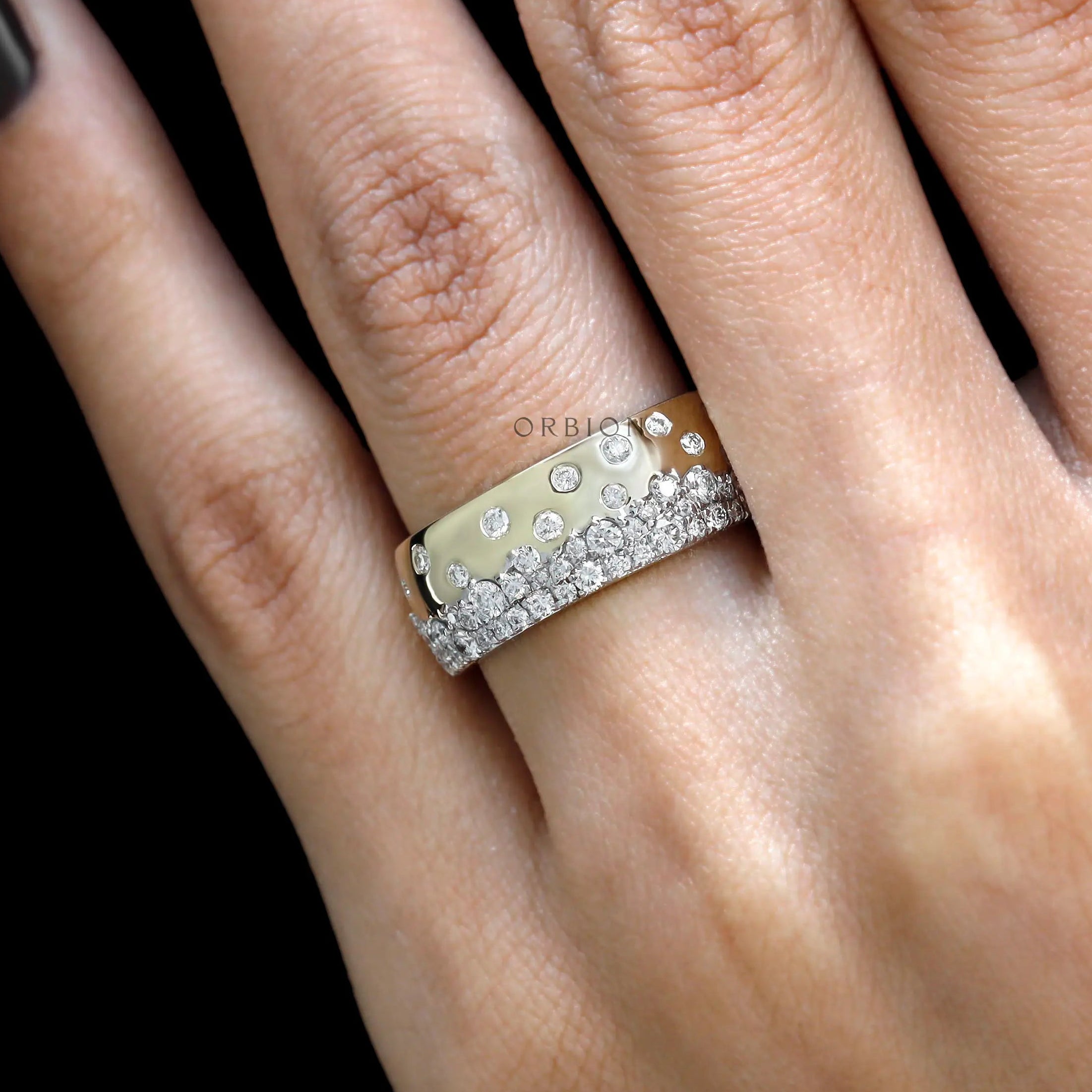 Close up hand shot of scattered galaxy diamond gold cigar band