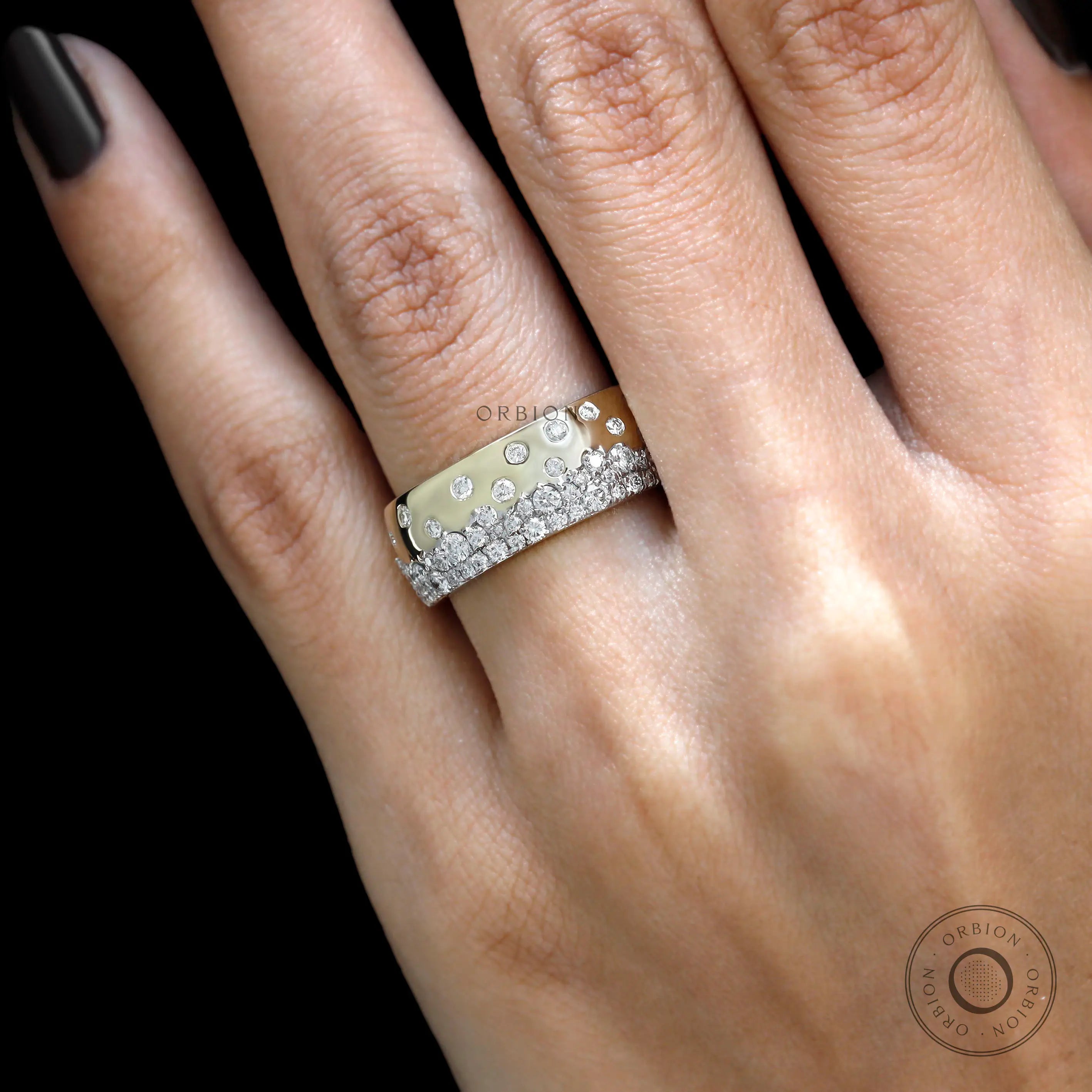 Close up hand shot of scattered galaxy diamond gold cigar band