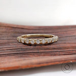 Front view yellow gold round diamond half eternity wedding band
