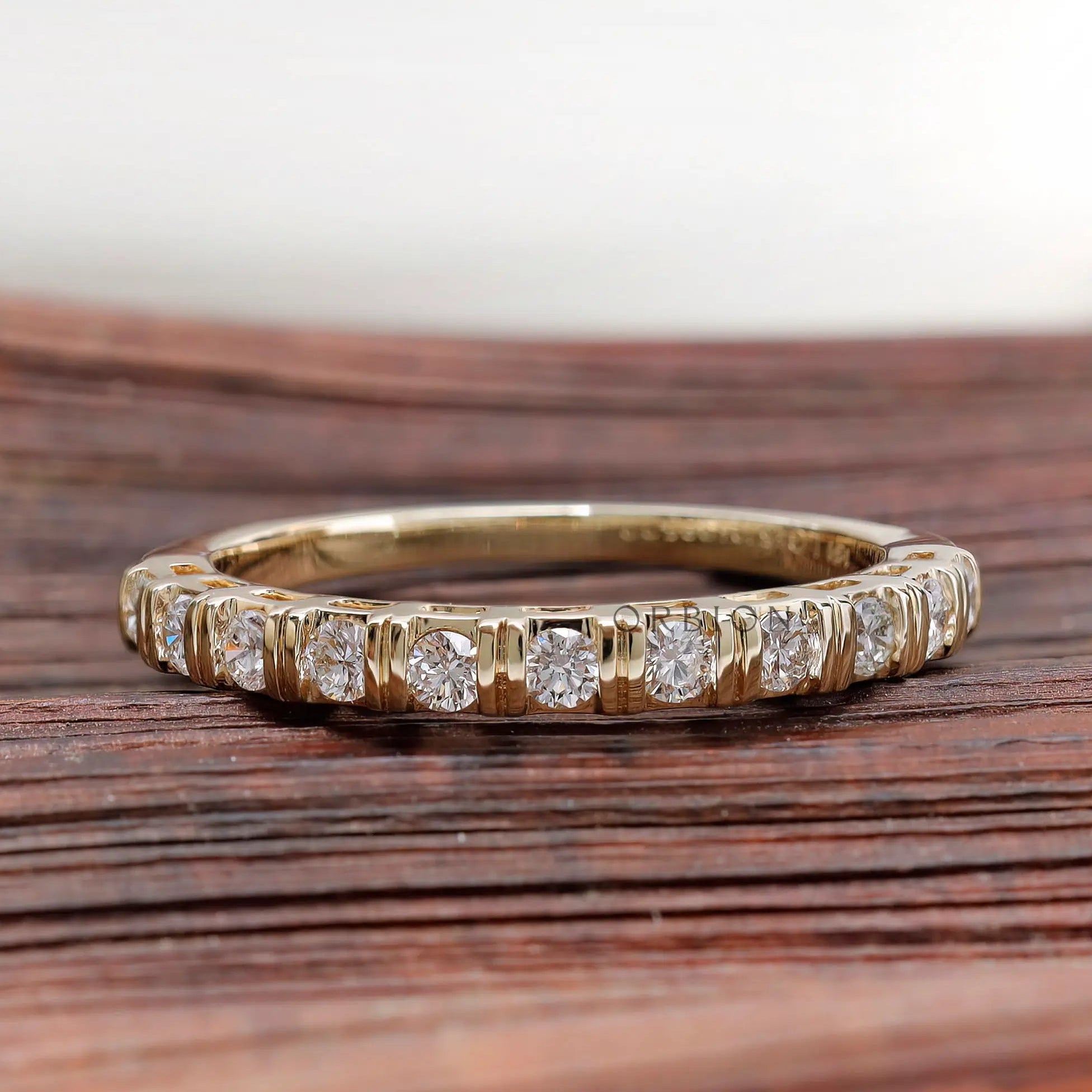 Front view yellow gold round diamond half eternity wedding band