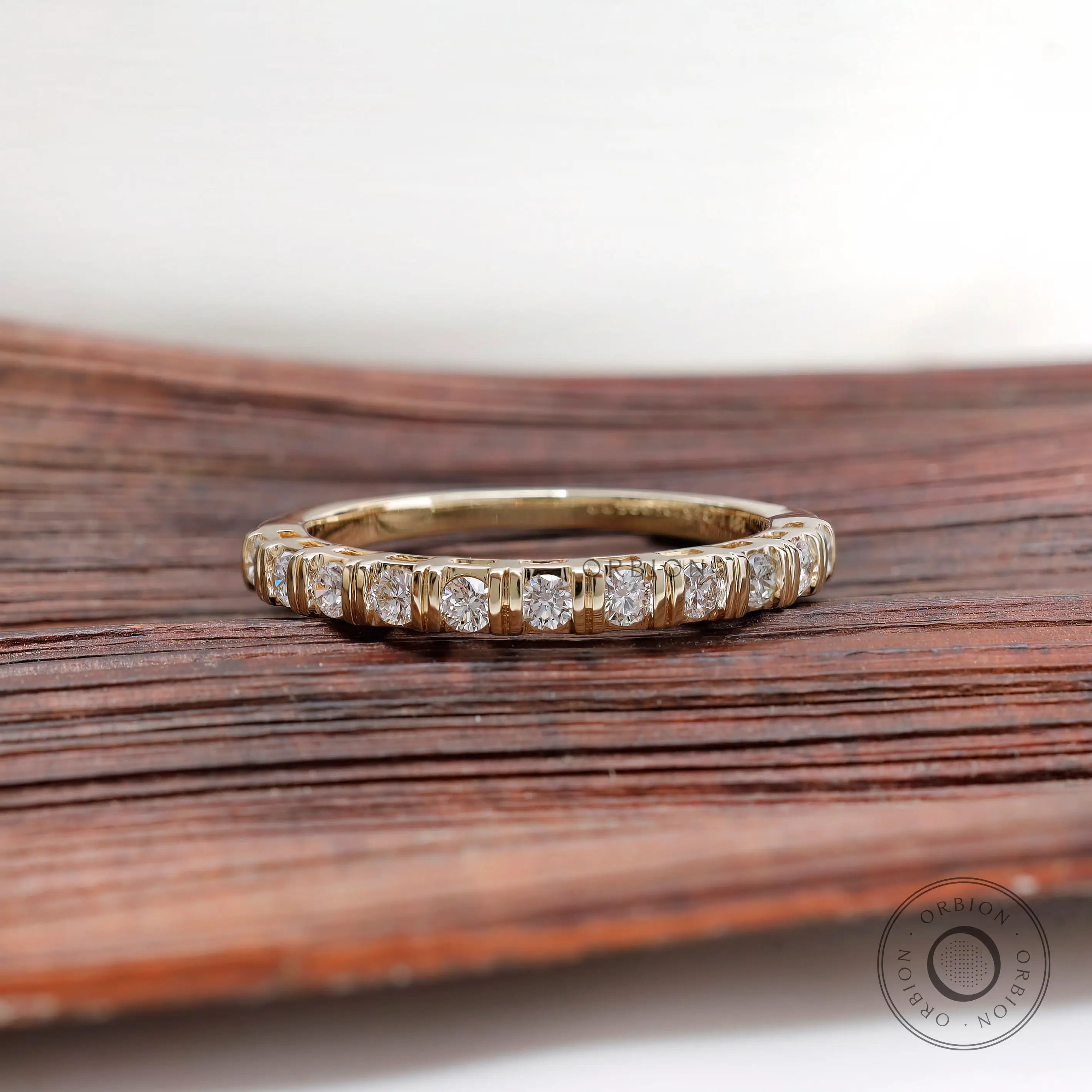 Front view yellow gold round diamond half eternity wedding band