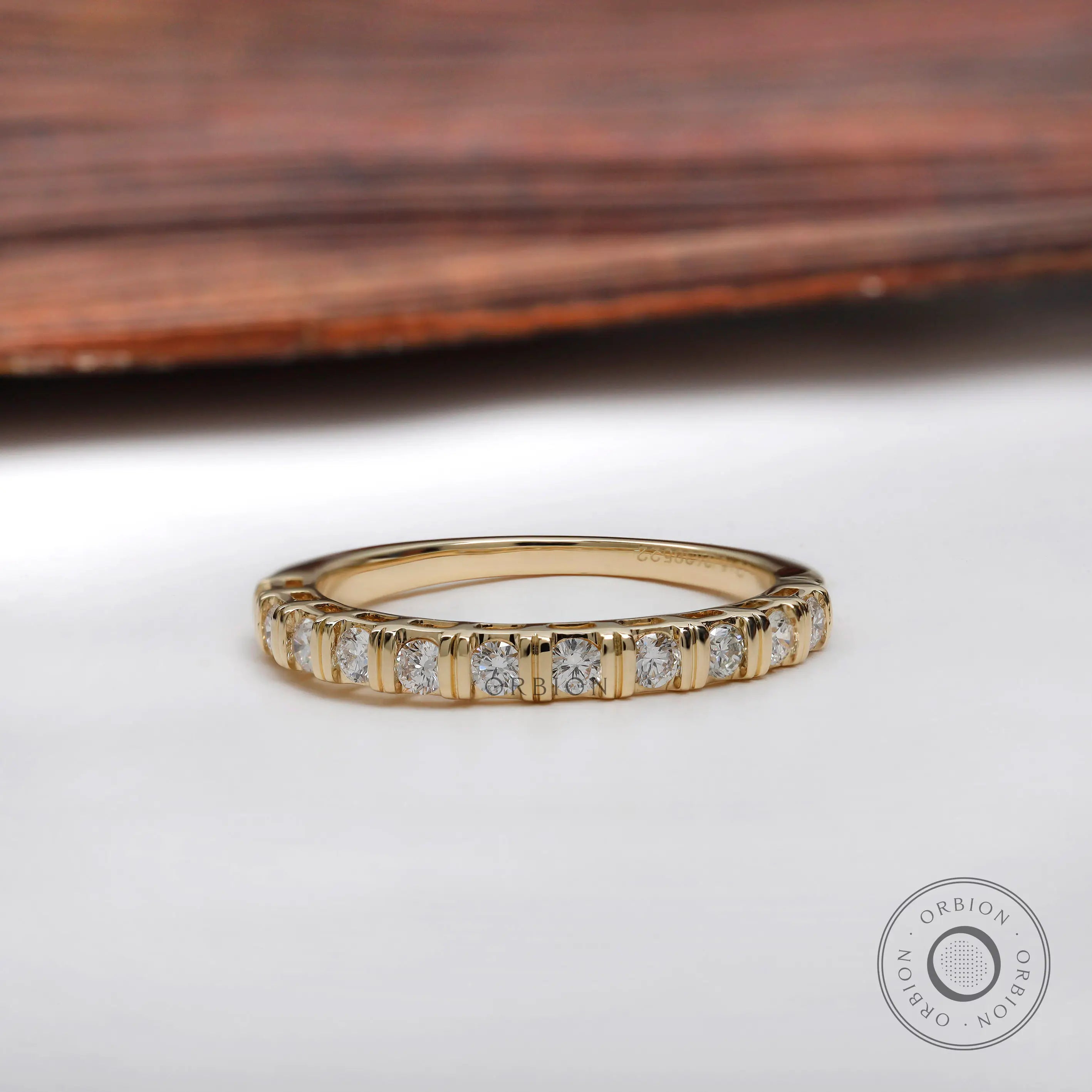 Top view yellow gold round diamond half eternity wedding band