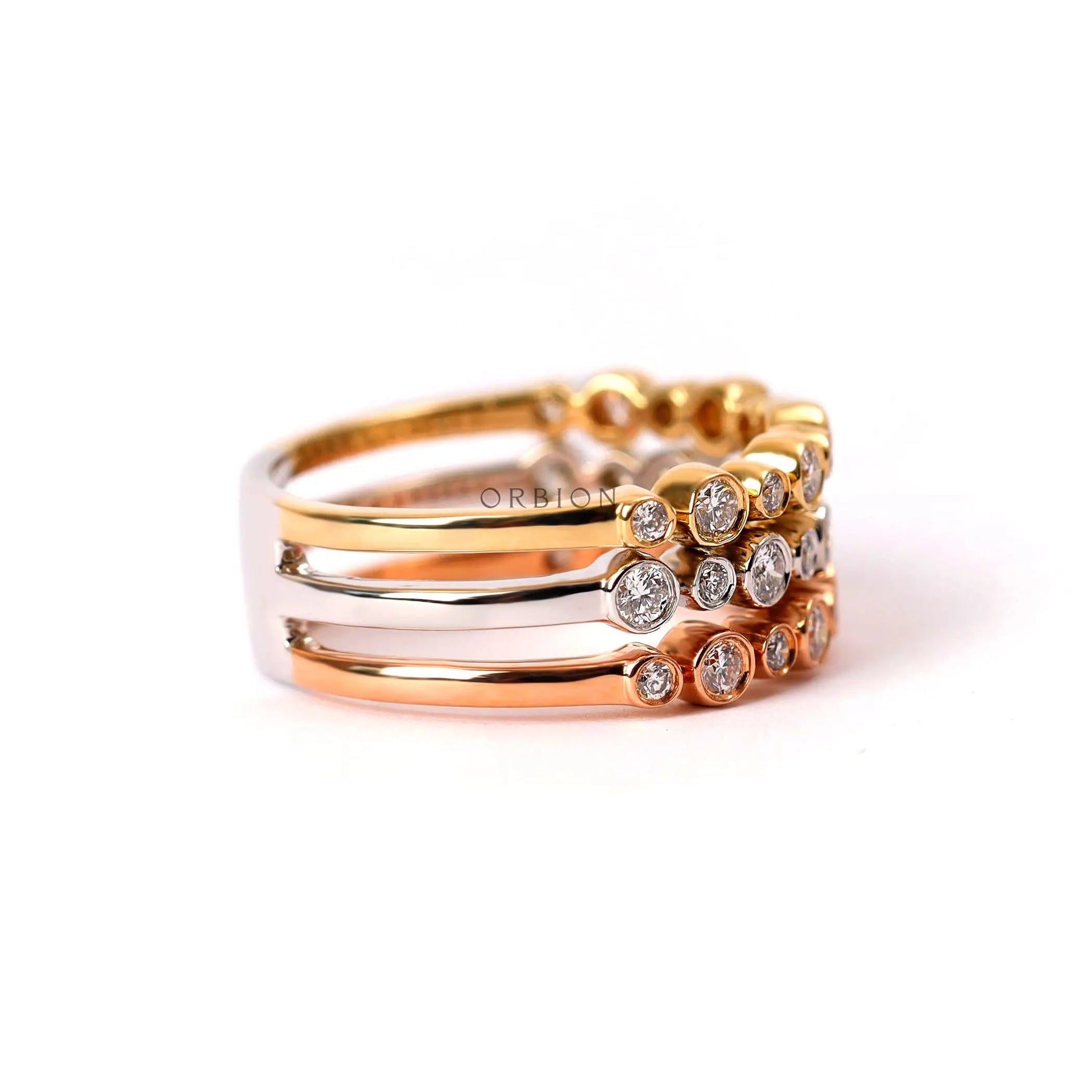 Three tone gold diamond anniversary ring stacked design top view